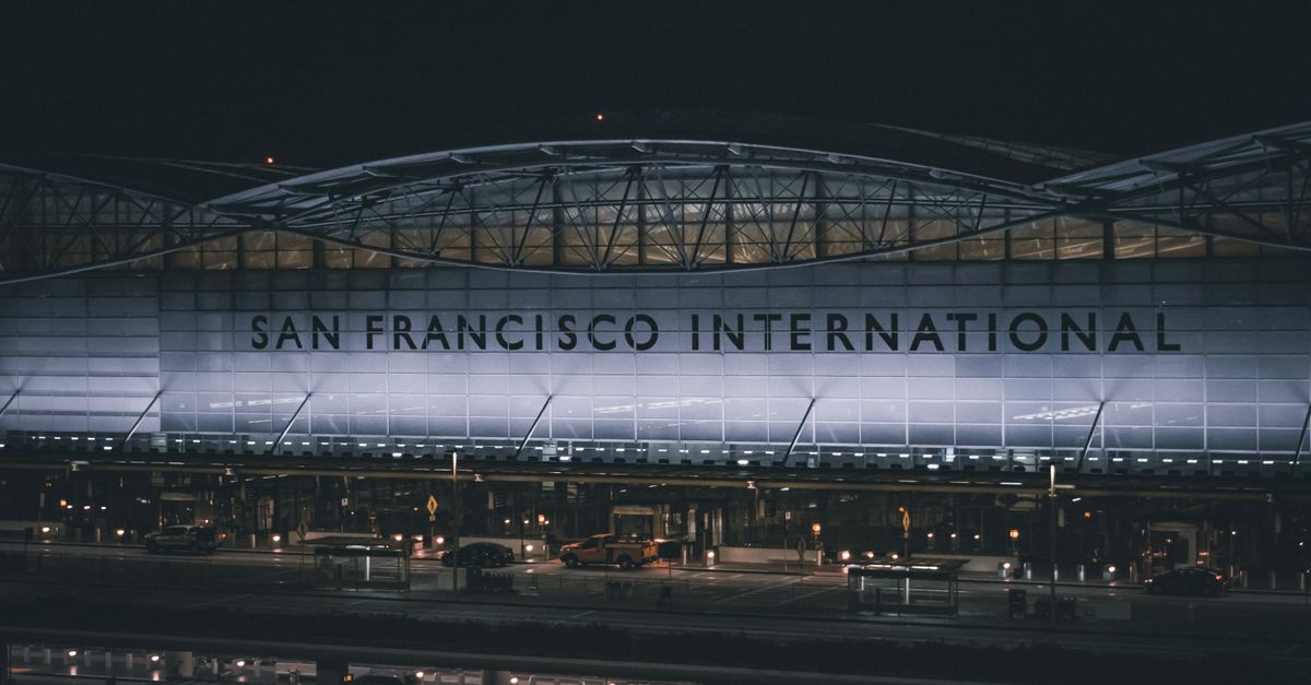 Dramatic nighttime view of the illuminated facade at San Francisco International Airport.